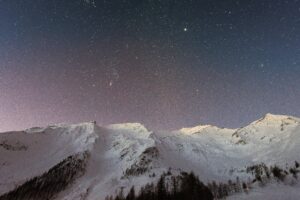 Mountain Covered Snow Under Star Background Wallpaper