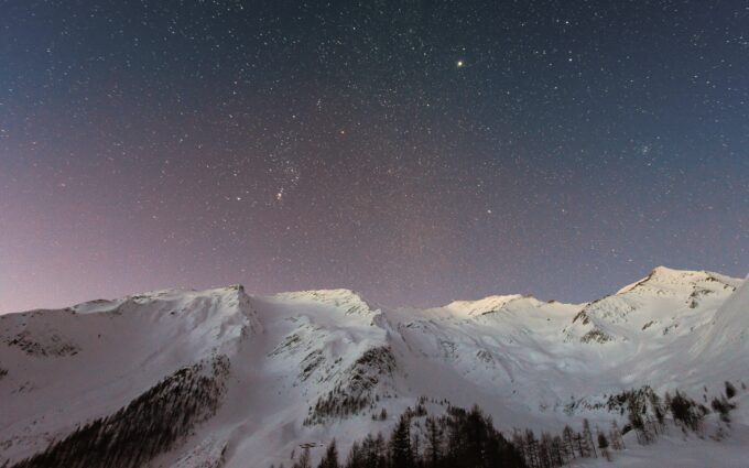 Mountain Covered Snow Under Star Background Wallpaper