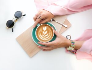 Woman Holding Cup of Latte Desktop Wallpapers